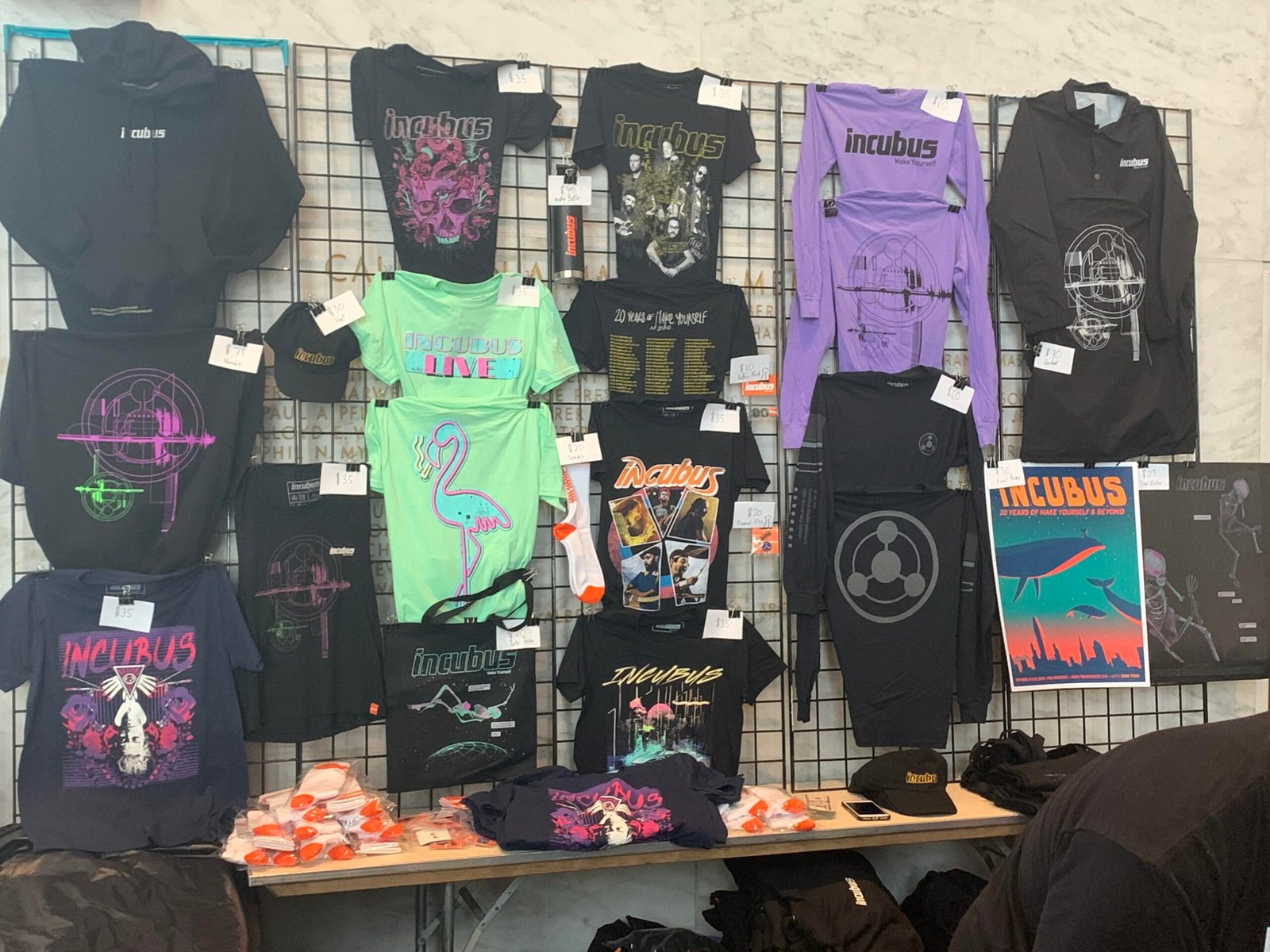 Band merch table with shirts and vinyl records